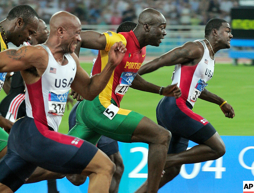 Francis Obikwelu (centre) wins Olympic 100m Silver for Portugal behind USA's Justin Gatlin and ahead of Maurice Greene. The favourite at the time Asafa Powell (with head dropped) finished in 5th! 