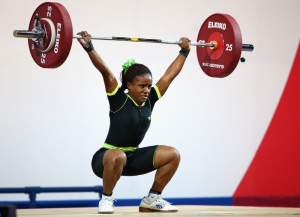 Chika Amalaha of Nigeria competes in the Women's 53kg Group A Weightlifting at the Scottish Exhibition And Conference Centre at the Glasgow 2014 Commonwealth Games on July 25, 2014 (Photo by Julian Finney/Getty Images)