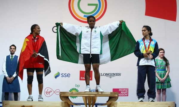 (L-R) Silver medalist Dika Toua of Papa New Guinea, Gold medalist Chika Amalaha of Nigeria and Bronze medalist Santoshi Matsu of India after the Women's 53kg Group A Weightlifting  (Photo by Julian Finney/Getty Images)