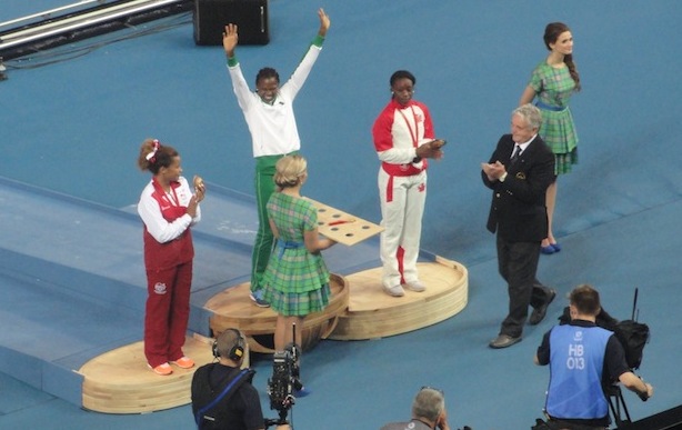 Ese Brume on the podium, celebrating her C'wealth GOLD in the Long Jump!