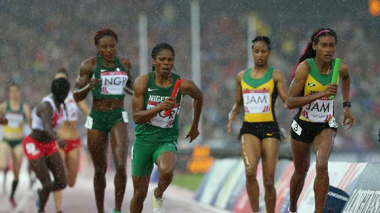 Folashade Abugan, 400m Nigerian Champion, after receiving the baton from Ada Benjamin for the last leg of the women's 4x400m at Hampden Park in Glasgow at the 2014 C'wealth Games. Jamaica won the GOLD, with Nigeria getting the Silver and England the Bronze! (Photo Credit: AP Photo/ Scott Heppell)