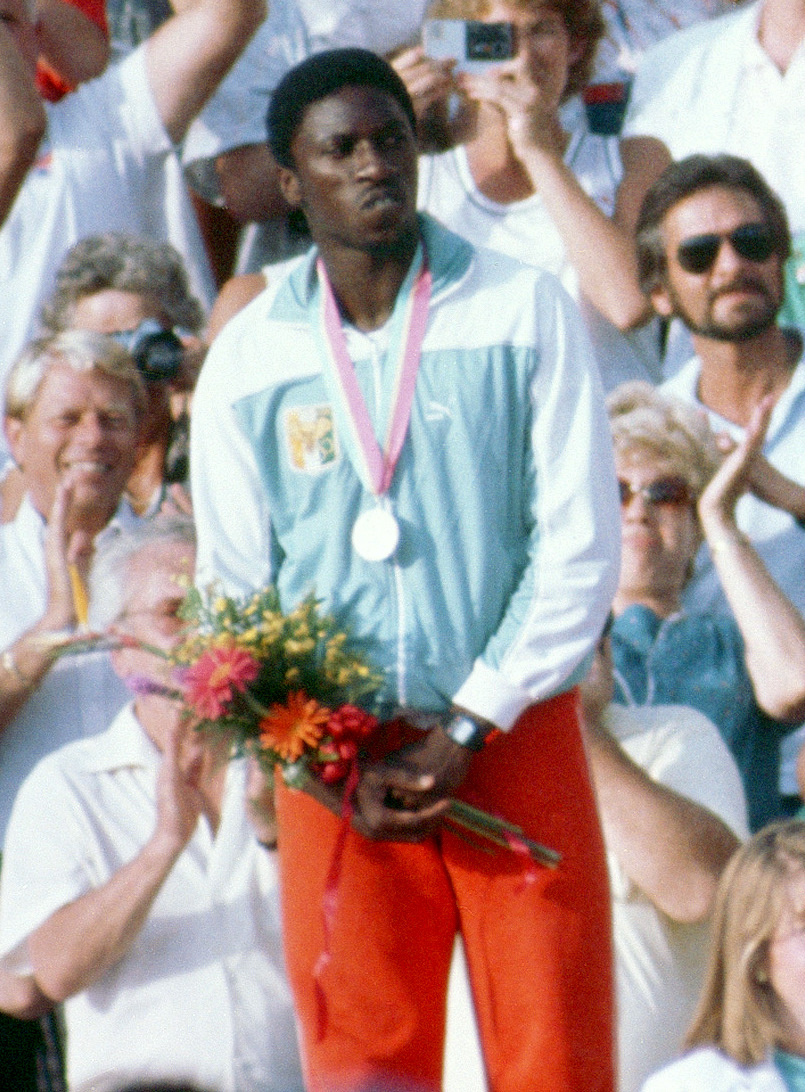  Gabriel Tiacoh won silver in the men's 400m at the 1984 Olympics, behind USA's Alonzo Babers. (Photo Credit: Wikipedia).