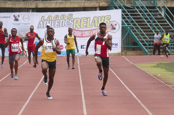 Team MoC's Hammed Yusuf (Right) slugs it out with a member of the Police relay team.