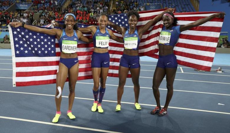 2016 Rio Olympics - Athletics - Final - Women's 4 x 100m Relay Final - Olympic Stadium - Rio de Janeiro, Brazil - 19/08/2016. Tori Bowie (USA) of USA, Tianna Bartoletta (USA) of USA, English Gardner (USA) of USA and Allyson Felix (USA) of USA celebrate winning the gold medal. REUTERS/Phil Noble TPX IMAGES OF THE DAY