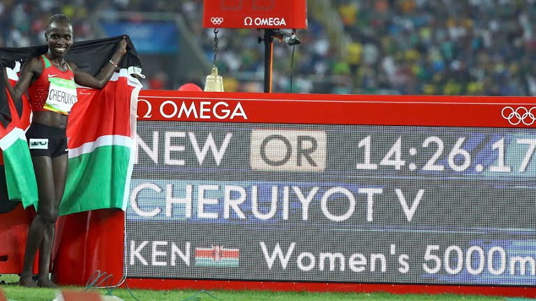 Vivian Cheruiyot standing by her new Olympic record in women's 5000m. Photo credit: Rio2016