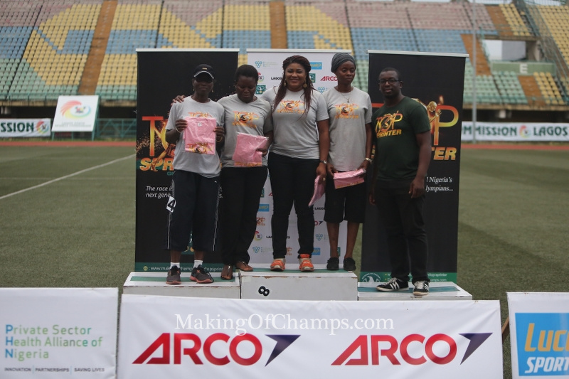 Competitors in the women's Masters race receive their prizes from MoC Founder, Bambo Akani.