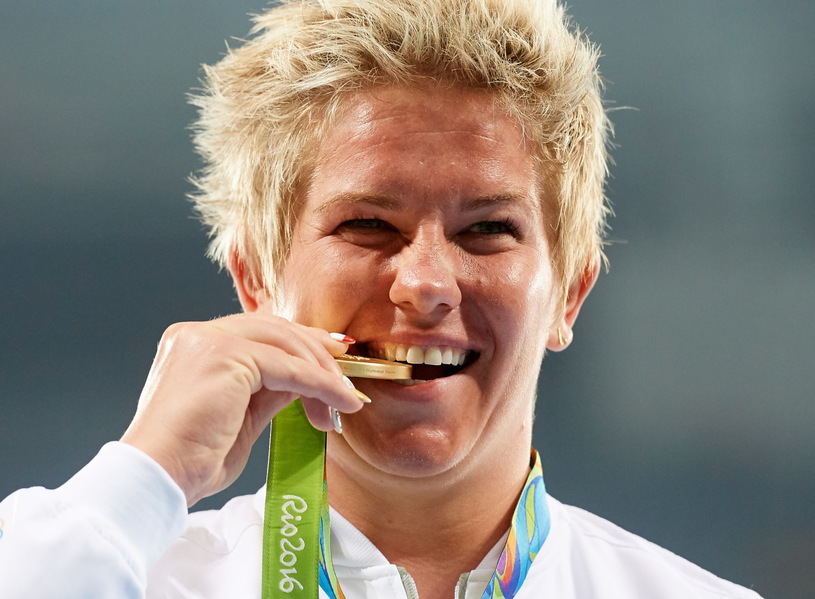 Wlodarczyk celebrates her Olympic GOLD medal. Photo Credit: Adam Warzaw / PAP